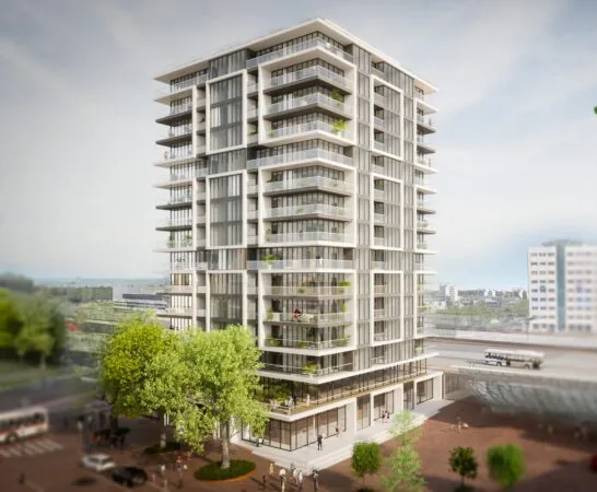 Moderne woontoren aan het Stationsplein met grote balkons en glazen gevels.