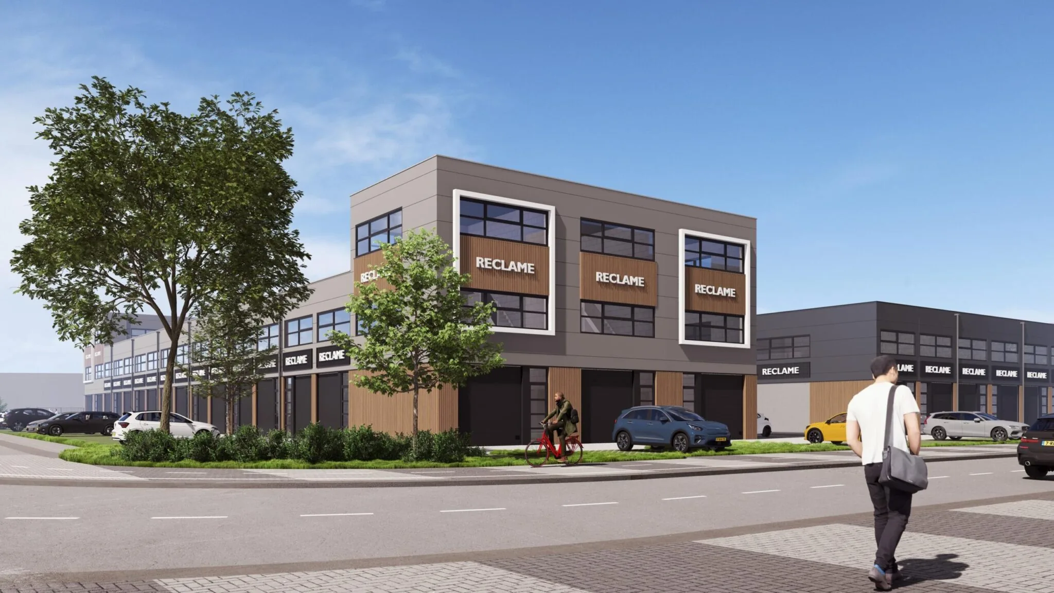 Moderne bedrijfsgebouwen aan de straat De Liesbosch met reclameborden op de gevels, omringd door auto's, fietsers en voetgangers.