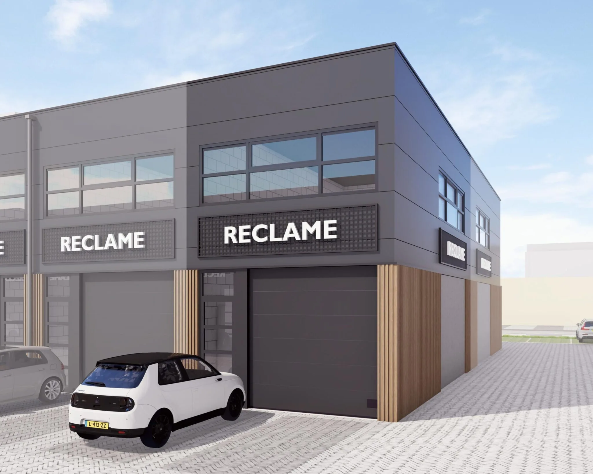 Moderne bedrijfsunit in bedrijfsverzamelgebouw De Liesbosch met zwarte gevel, grote ramen en geparkeerde auto's.