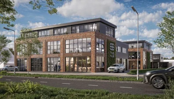Modern bedrijfsgebouw 'The Hub' aan de Hoofdweg met bakstenen gevel en grote raampartijen.