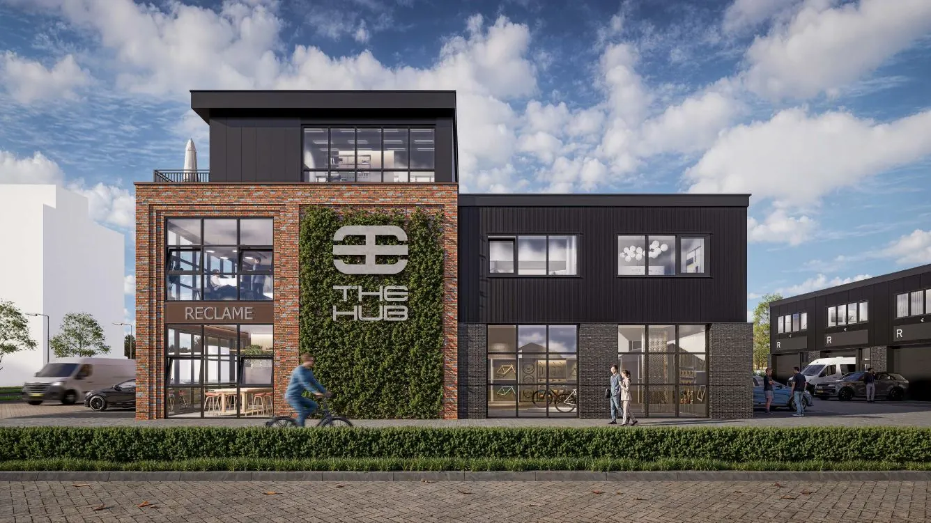 Modern bedrijfsgebouw aan de Hoofdweg met het logo van The Hub en gevelbegroeiing.