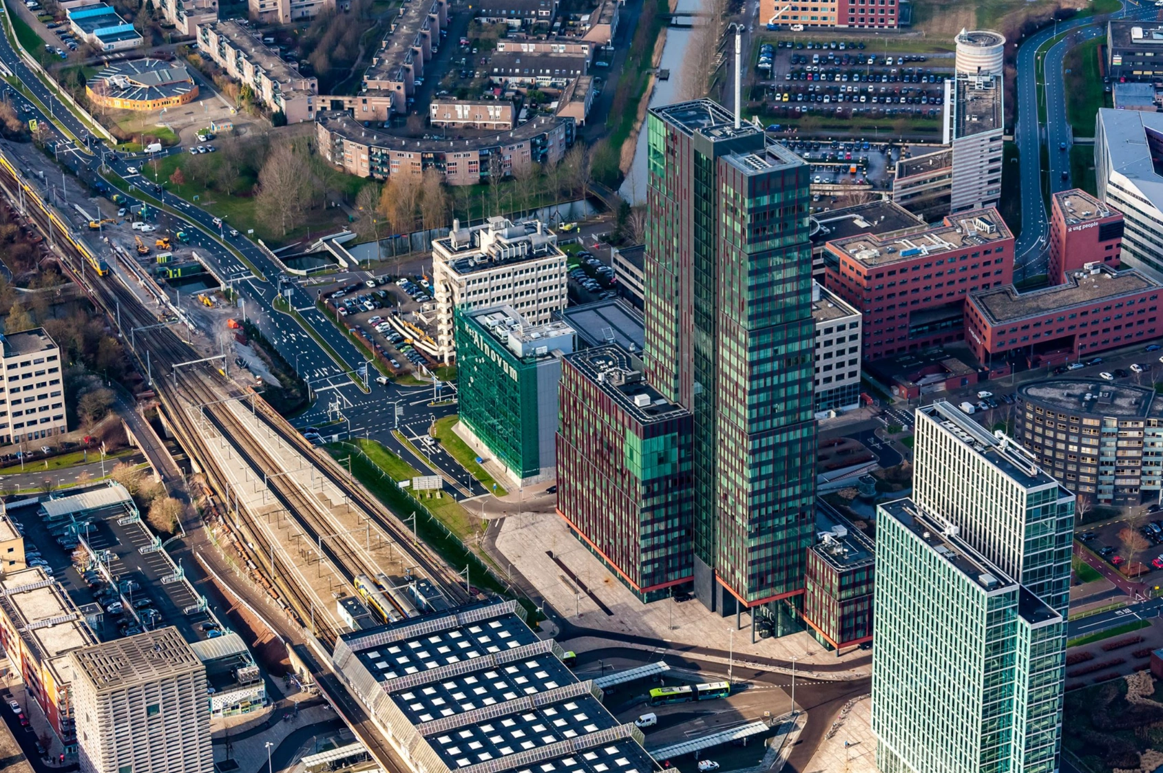 Aerial view of the high-rise office buildings and surrounding infrastructure at P.J. Oudweg in Almere, Netherlands.