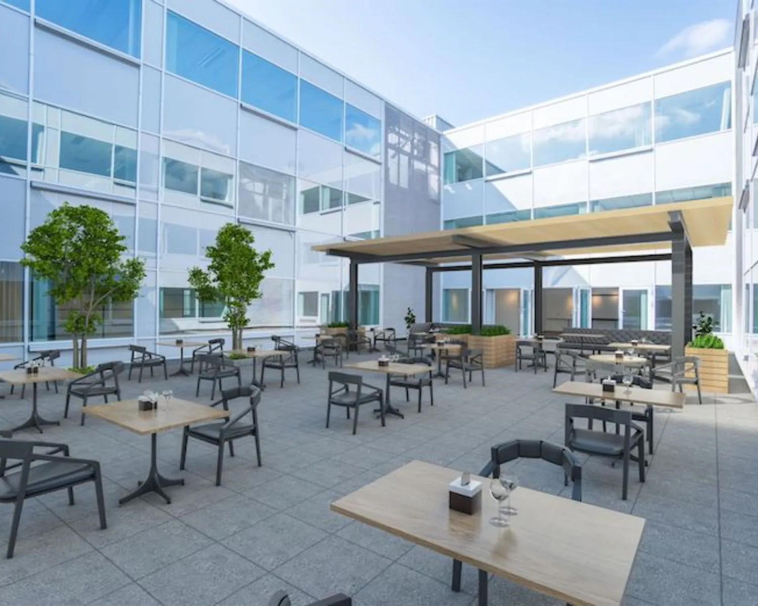 Moderne binnentuin met zitplekken bij kantoorruimte Reeuwijkse Poort 114 in Reeuwijk.