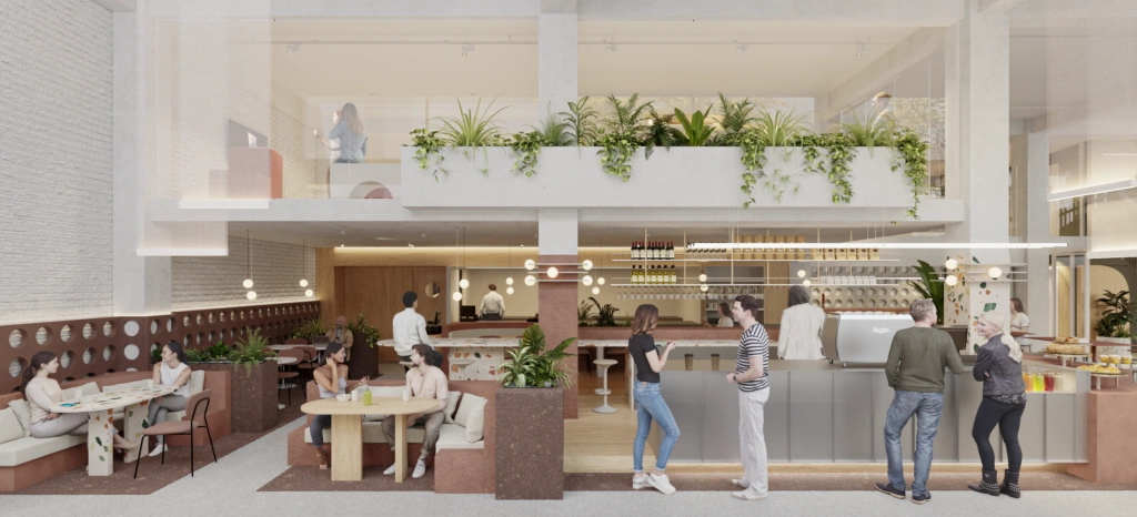 Moderne, open eetruimte met meerdere mensen die eten, drinken en met elkaar praten in een lichte, groene omgeving.