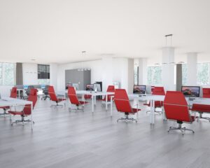 Moderne kantoorruimte aan de Bolderweg 1 in Almere met open werkplekken en rode bureaustoelen.