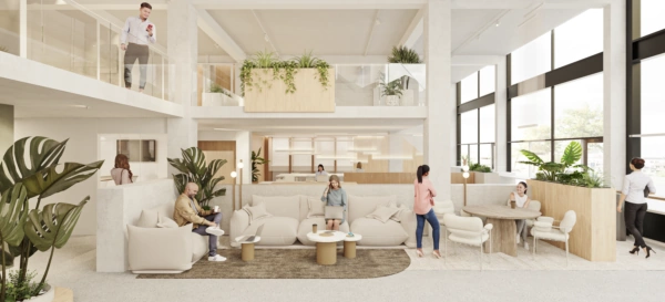 Moderne open werkruimte met meerdere mensen die werken, praten en ontspannen in een lichte, groen ingerichte omgeving.