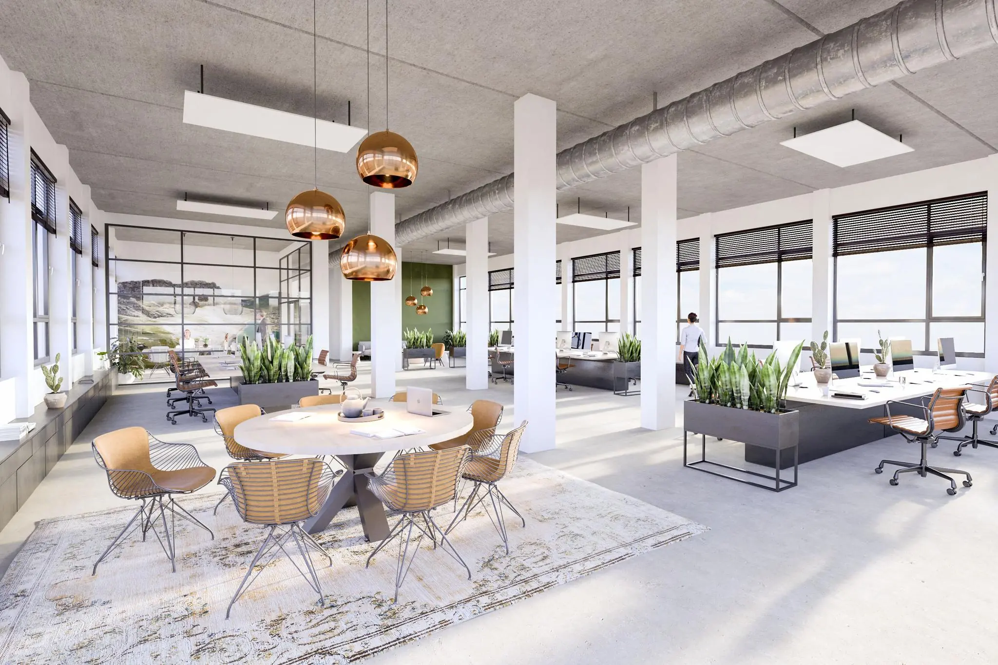 Modern en licht kantoorinterieur aan de Lindtsedijk met open werkplekken, ronde vergadertafel en veel planten.