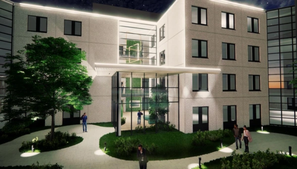 Avondimpressie van de ingang van het moderne kantoorgebouw Rijnzathe met verlichte gevel en glazen entree.