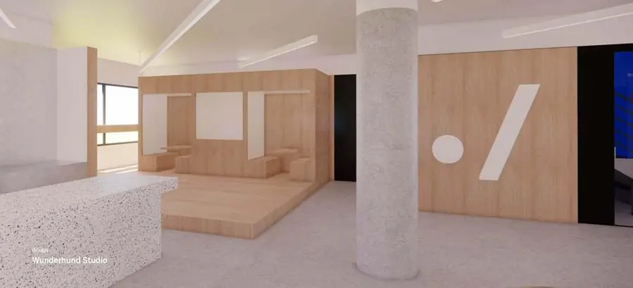 Moderne, minimalistische kantoorruimte aan de Europalaan 500 met houten interieur, terrazzo balie en betonnen zuil.