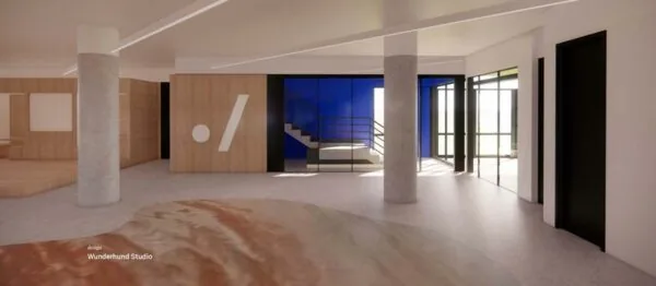 Moderne entreehal van Europalaan 500 met houten wanden, betonnen pilaren en een opvallende blauwe trapruimte.