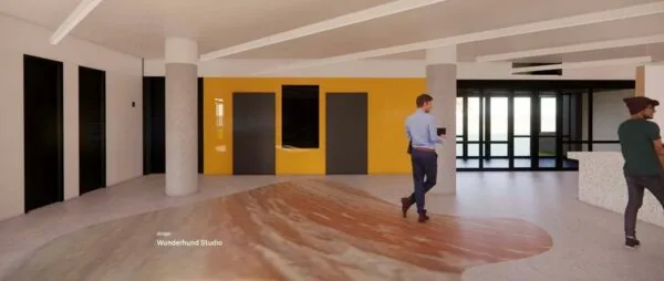 Moderne kantoorlobby aan de Europalaan 500 met gele accentmuur, kunstvloer en bezoekers.