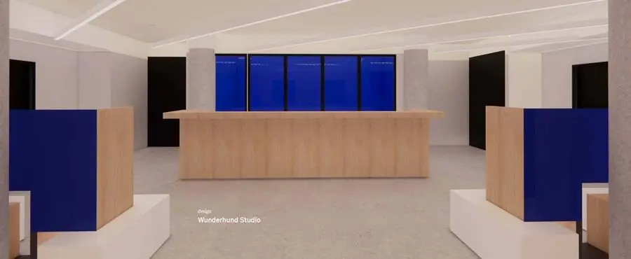 Moderne ontvangstbalie met houten afwerking en blauwe accenten in het interieur van Europalaan 500.