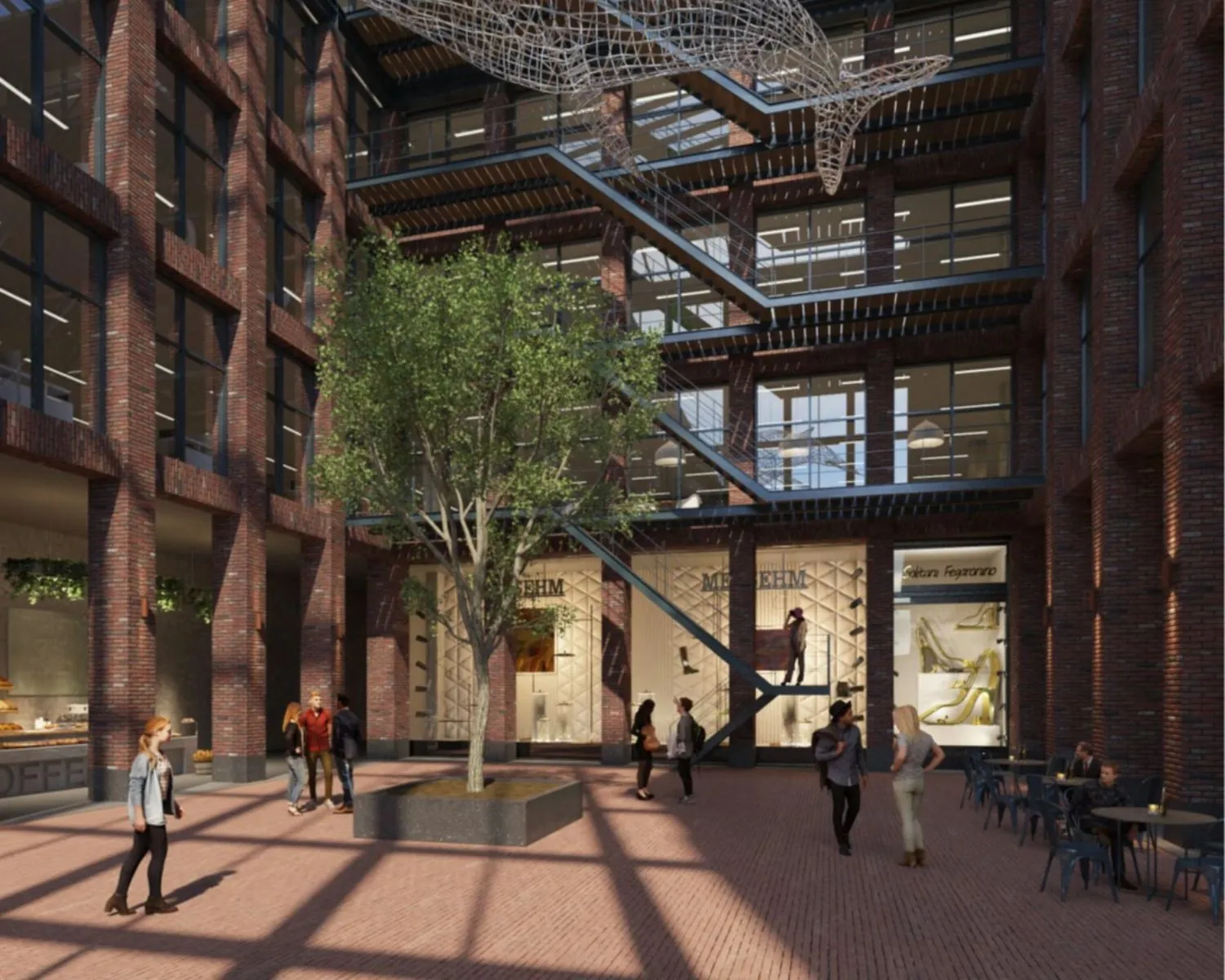 Moderne binnentuin van een kantoorpand aan de Danzigerkade 14-15 in Amsterdam met bakstenen gevels, een grote boom, en mensen op het terras.