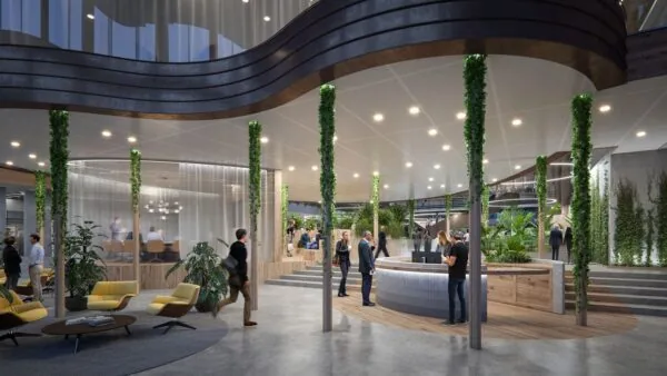 Moderne en groene ontvangsthal van kantoorruimte aan de Fred. Roeskestraat 100 in Amsterdam met receptie, zitgedeelte en vergaderruimte.