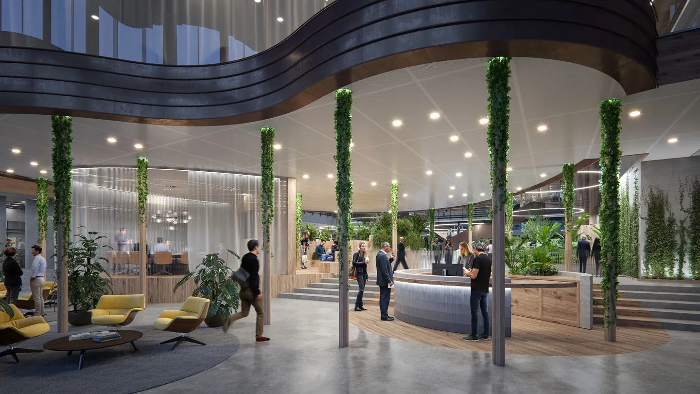 Moderne en groene ontvangsthal van kantoorruimte aan de Fred. Roeskestraat 100 in Amsterdam met receptie, zitgedeelte en vergaderruimte.