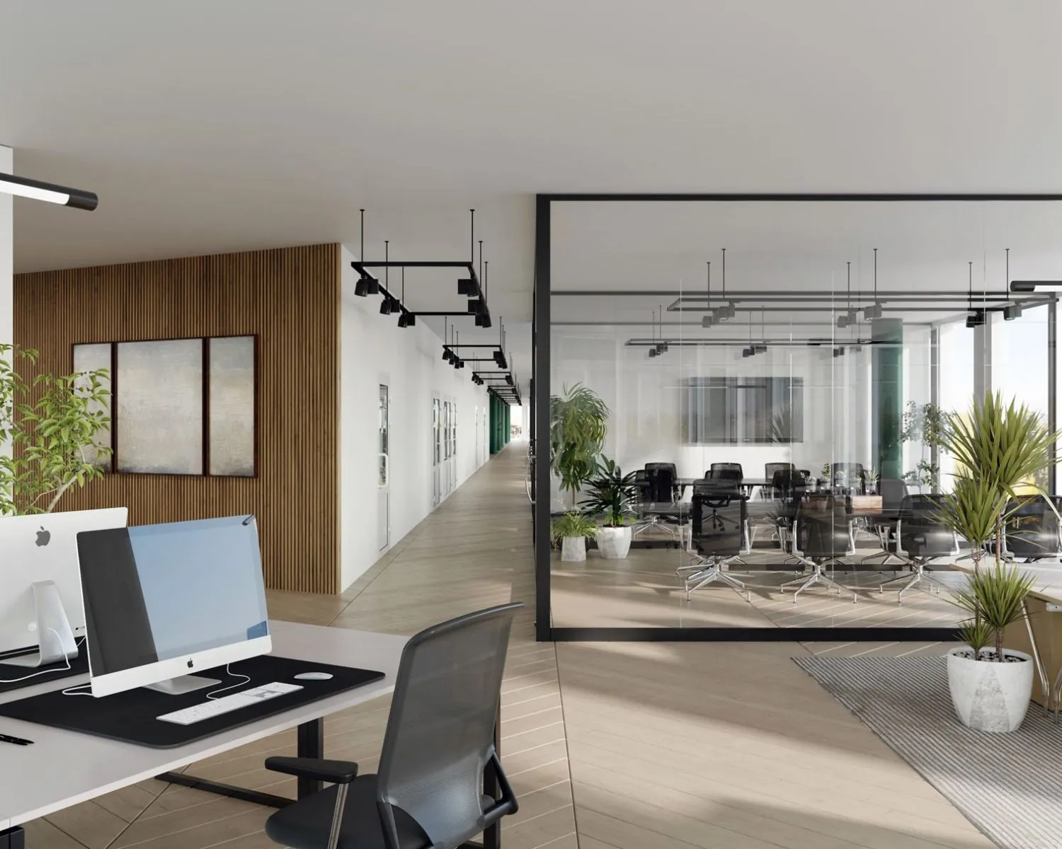 Moderne kantoorruimte te huur aan het John M. Keynesplein 10 in Amsterdam met strakke werkplekken en een glazen vergaderruimte.