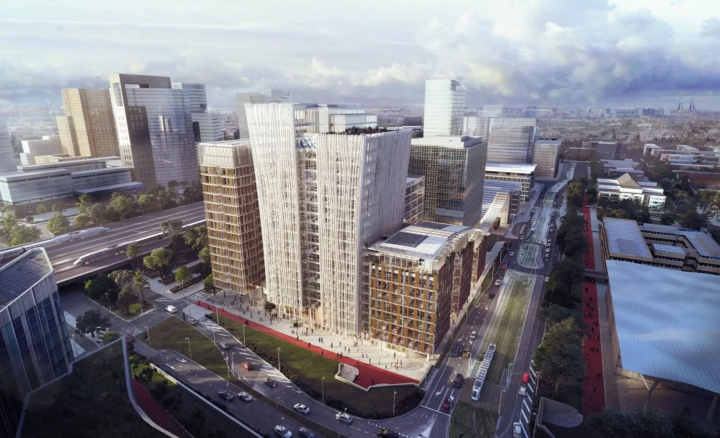 Luchtfoto van moderne kantoorgebouwen aan de Strawinskylaan 1 in Amsterdam, met zicht op wegen, tramlijn en omliggende zakelijke wijk.