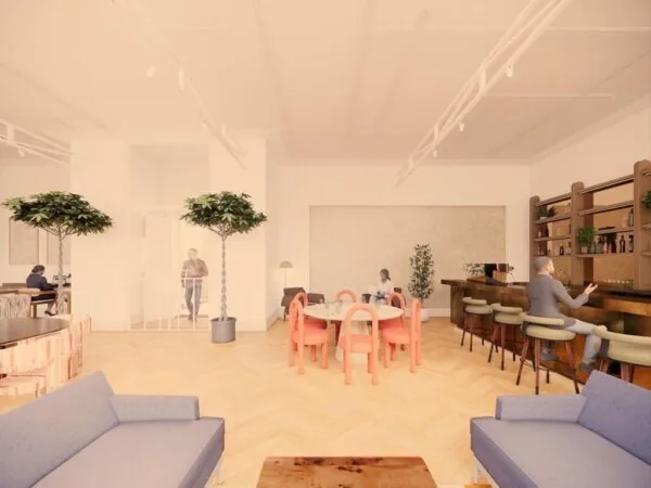 Moderne, lichte kantoorruimte aan de Keizersgracht 264 in Amsterdam met loungehoek, ronde vergadertafel en bar met zitplaatsen.