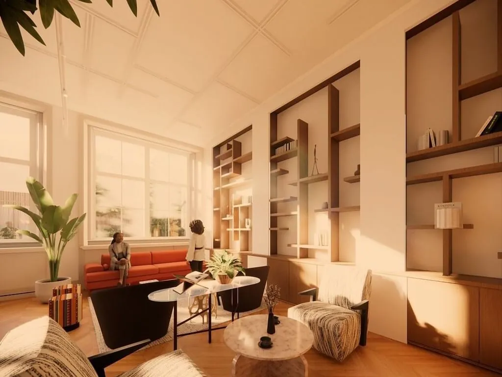 Stijlvol ingerichte kantoorruimte aan de Keizersgracht 264 in Amsterdam met zitgedeelte, grote ramen en ingebouwde boekenkasten.