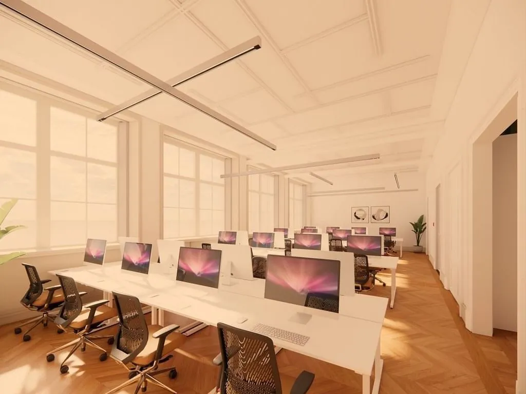 Moderne kantoorruimte met open werkplekken en iMacs aan de Keizersgracht 264 in Amsterdam.