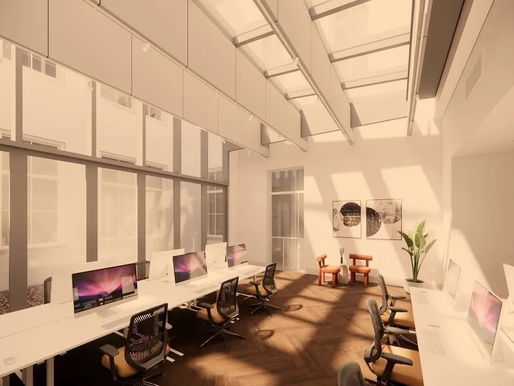 Moderne kantoorruimte op Keizersgracht 264 in Amsterdam met hoge plafonds, glazen dak en werkplekken met computers.