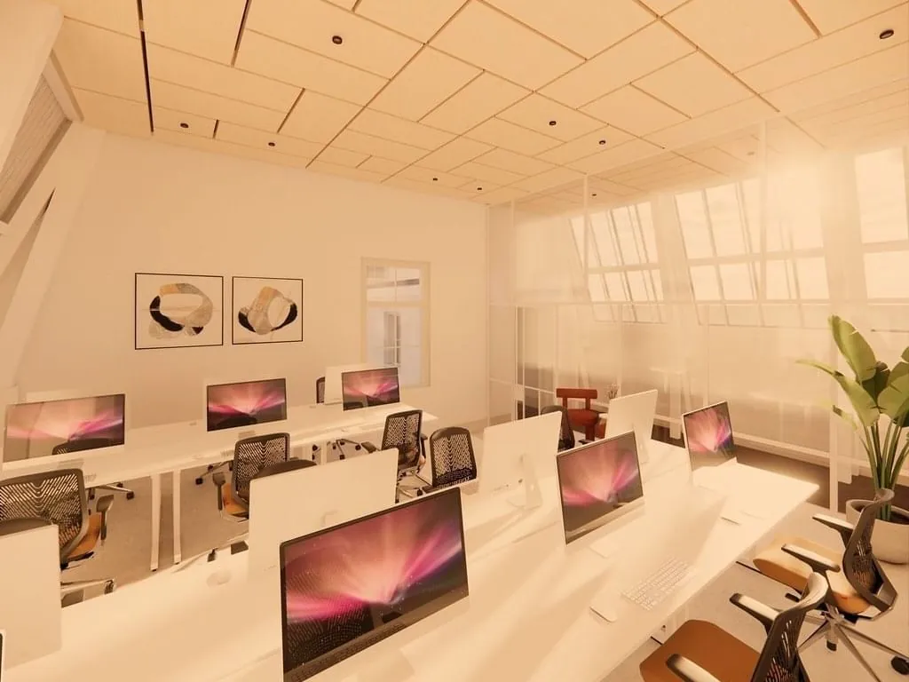 Modern ingerichte kantoorruimte met werkplekken en grote ramen aan de Keizersgracht 264 in Amsterdam.