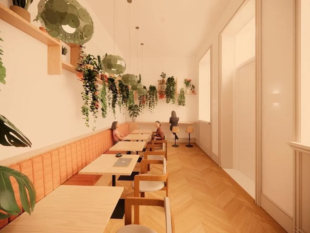 Moderne kantoorruimte aan de Keizersgracht 264 in Amsterdam met lange werktafel, sfeervolle hangplanten en warme houten accenten.