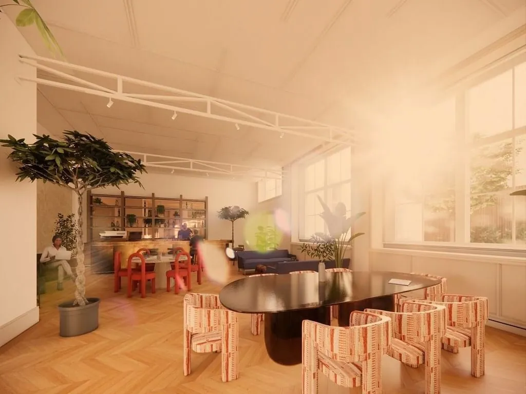 Lichte en moderne kantoorruimte aan de Keizersgracht 264 in Amsterdam met grote ramen, designmeubilair en veel groen.