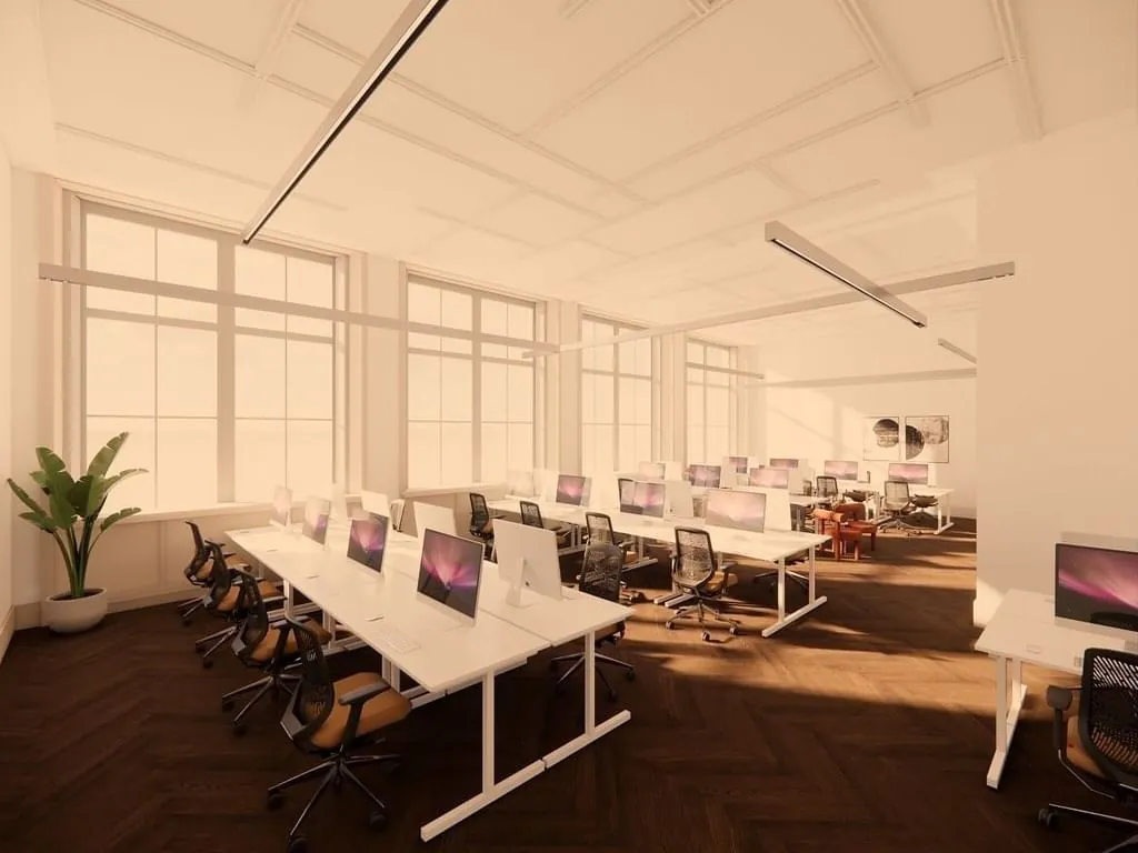 Moderne, lichte kantoorruimte aan de Keizersgracht 264 in Amsterdam met werkplekken en grote ramen.