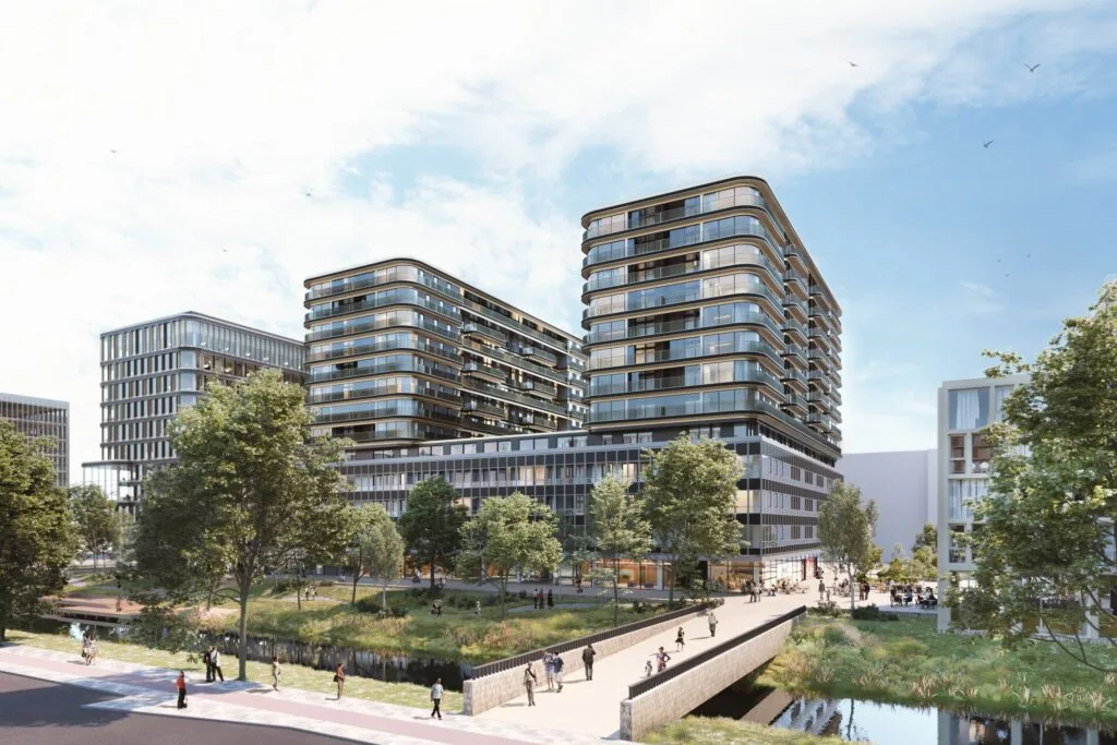 Moderne kantoorgebouwen en appartementencomplexen aan het Koningin Wilhelminaplein met groenstroken, een waterpartij en een voetgangersbrug.