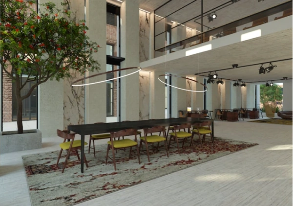 Moderne, hoge ruimte aan de Papaverweg 37B met een lange eettafel, designverlichting en een boom in een plantenbak.