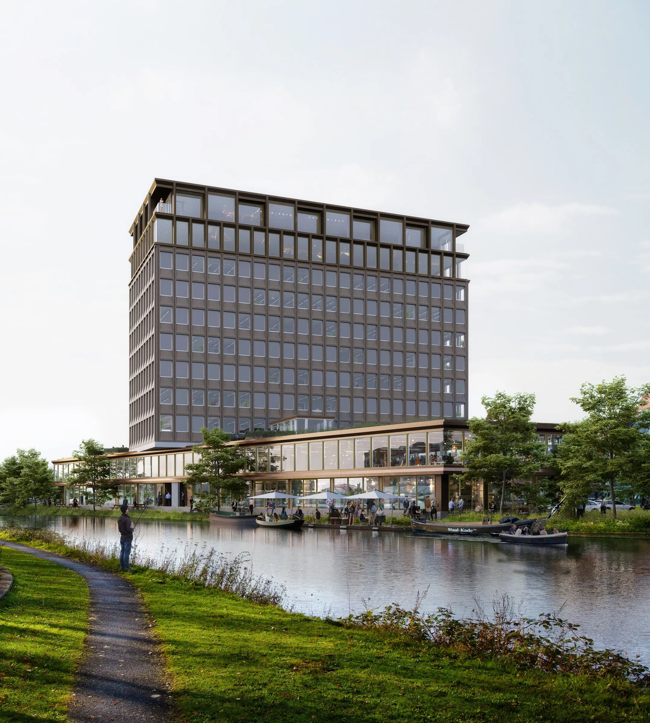 Modern kantoorgebouw aan de Rijnsburgstraat met grote ramen, gelegen aan een waterpartij met wandelpad en groen.