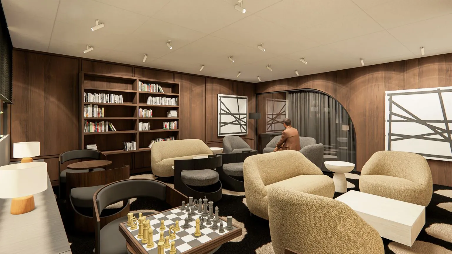 Moderne lounge aan de Strawinskylaan met comfortabele zitplaatsen, boekenrekken, abstracte kunst en een schaaktafel.