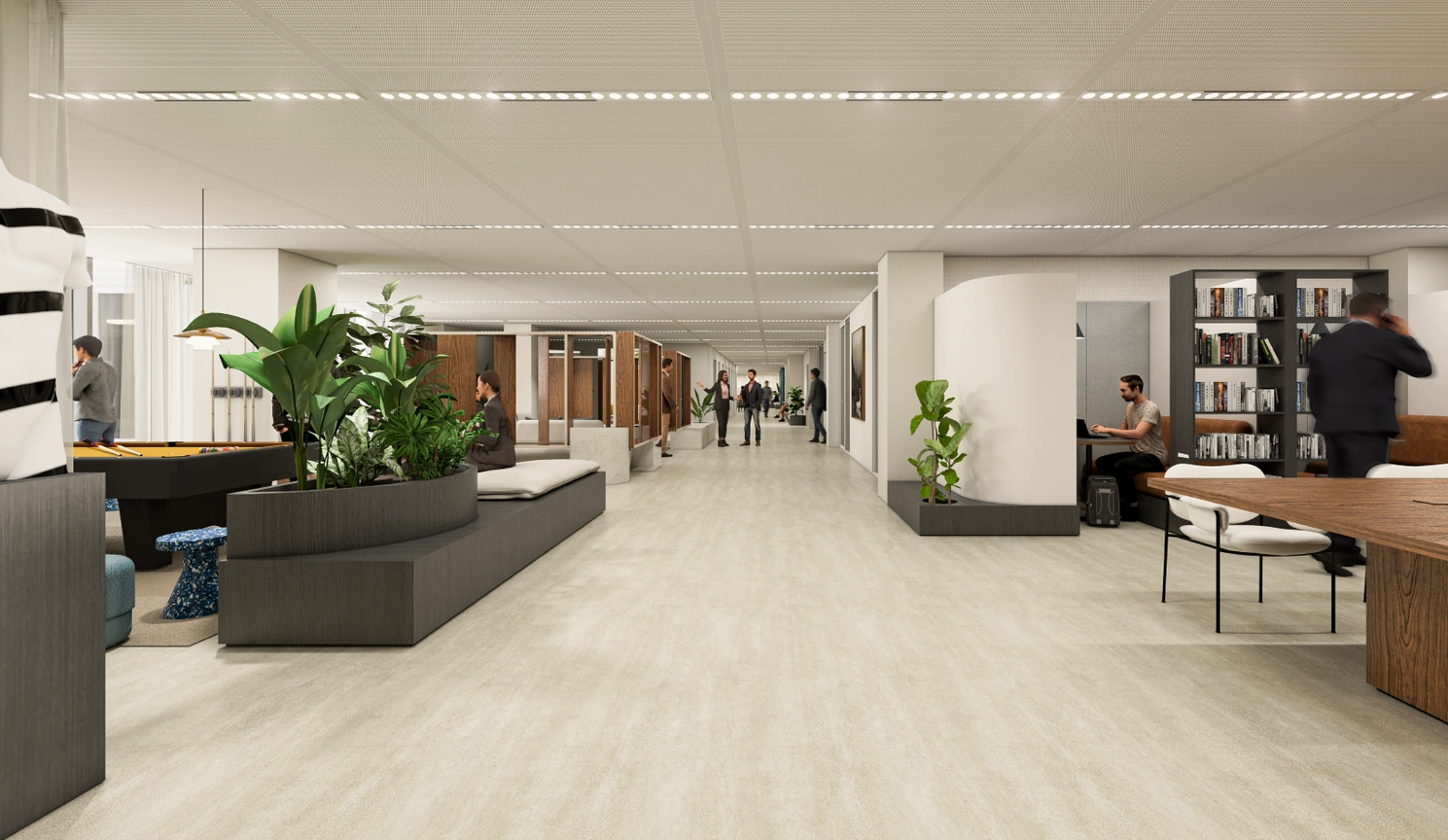 Modern ingericht kantoorinterieur van Strawinskylaan 5 met open werkplekken, zitruimtes en groene planten.