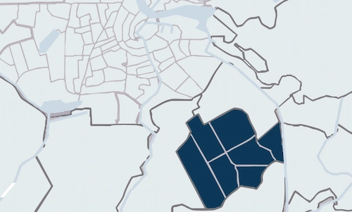 Map highlighting the Zuidoost district in dark blue within a simplified layout of Amsterdam.