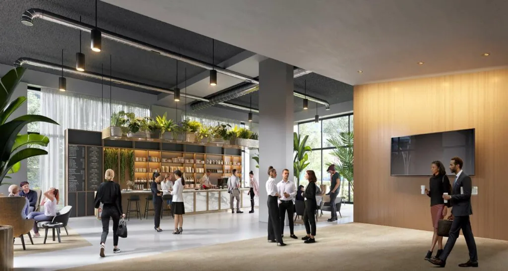 Moderne entree met een koffiebalie, veel groen en mensen in gesprek of onderweg.