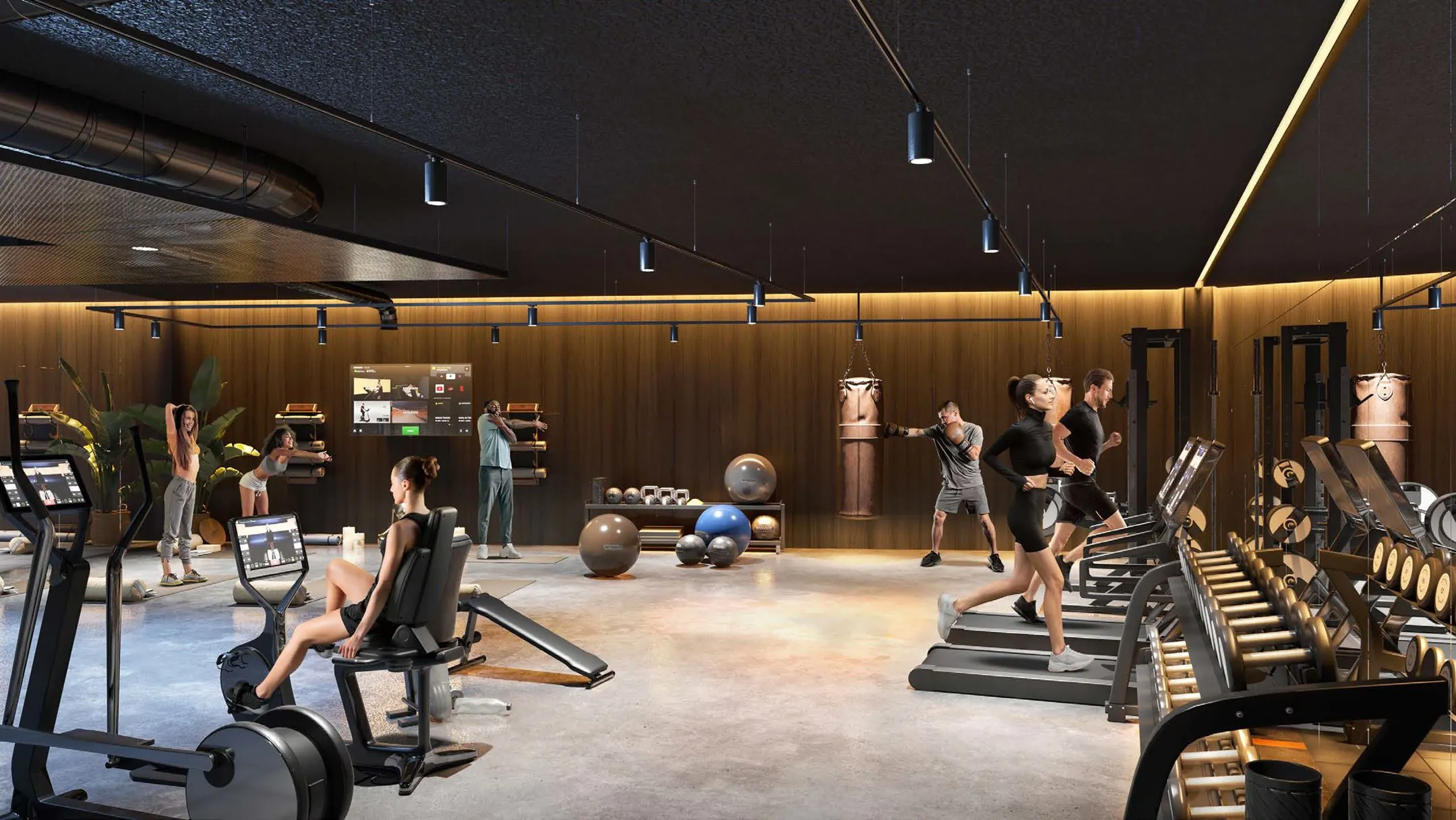 Moderne fitnessruimte van Entree 201 met sportende mensen op verschillende apparaten en trainingszones.