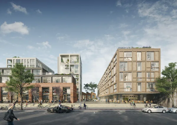 Moderne stadsontwikkeling met het Front A2 gebouw, bestaande uit een mix van hout, glas en baksteen, met winkels, woningen en een levendig plein op de voorgrond.