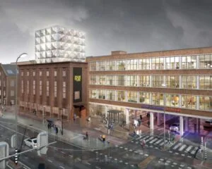 Kantoorgebouw aan de Haarlemmerstraatweg 13-4 met moderne glazen opbouw en zichtbare bedrijvigheid binnen.