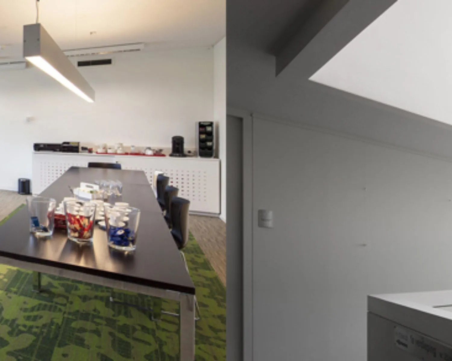 Vergaderruimte met lange tafel, stoelen en koffiecorner in een kantoorruimte aan de Transportlaan 30.