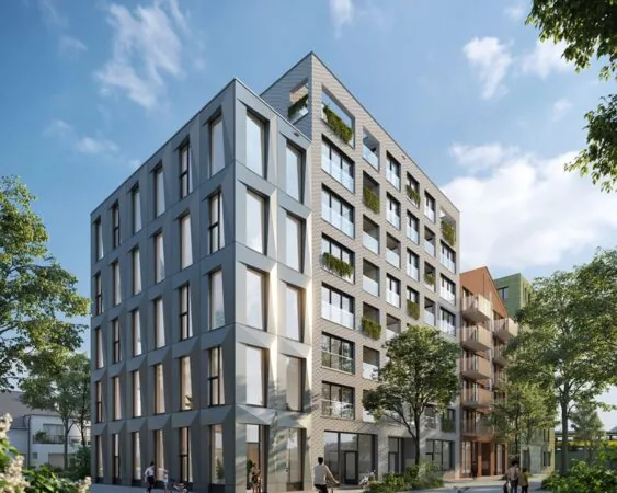 Modern kantoorgebouw aan de Oostenburgermiddagstraat 601 met grote ramen en groene gevelaccenten.