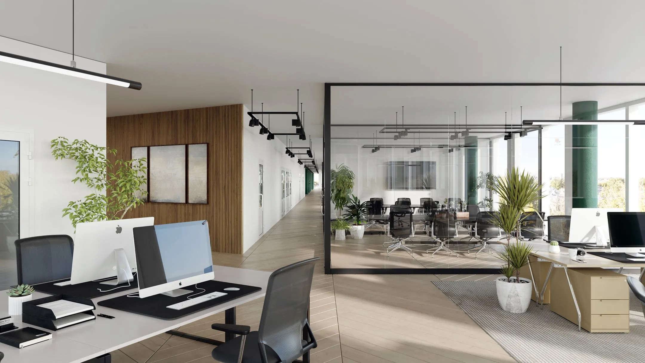 Moderne kantoorruimte met glazen vergaderruimte, werkplekken en veel natuurlijk licht aan het John M. Keynesplein 10 in Amsterdam.