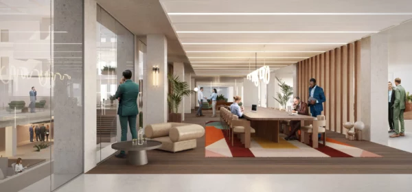 Moderne kantoorruimte in het Strawinskyhuis op de Zuidas met open werkplekken, vergaderruimtes en mensen in gesprek.